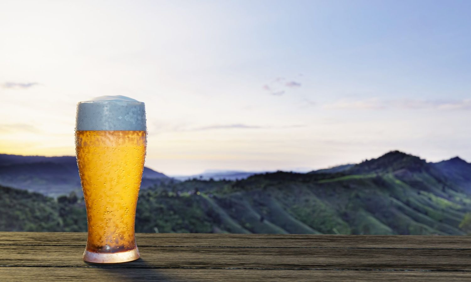 light beer with a view of green mountains in the background. 